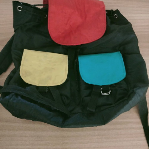 Backpack used with colorful cheerful designs and two front pockets
