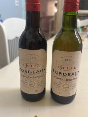 Wine collectible small red and white sealed bottles