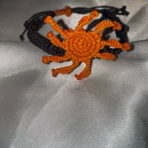 Macrame bracelet like new with adjustable fastening, black and orange