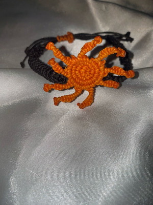 Macrame bracelet like new with adjustable fastening, black and orange