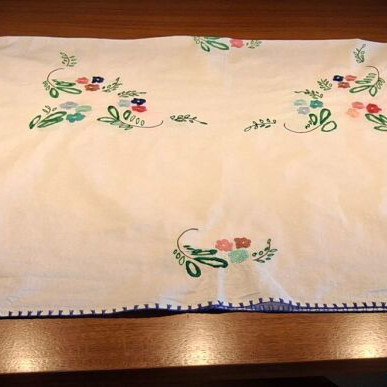 Vintage handmade embroidered tablecloth with flowers and needlework