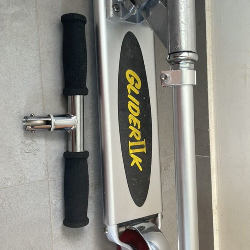 Scooter used with adjustable handlebar height and rear wheel brake
