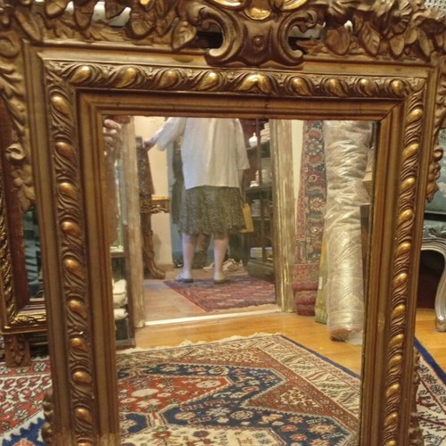 Louis XVI style French wall mirror with carved giltwood frame