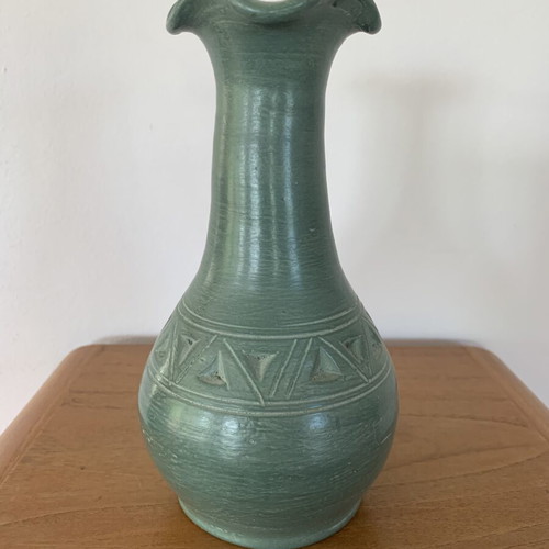 Handmade ceramic vase with carved geometric patterns, like new