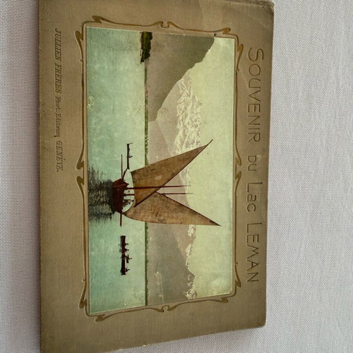 Leather-bound book with used Swiss Geneva postcard images