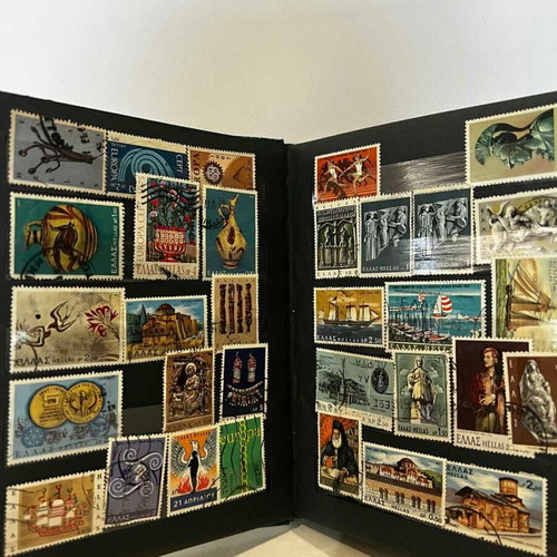 Stamp album with various collectible stamps used, 19x14.5 cm