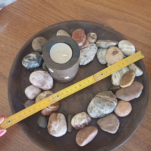 Decorative table set with stones and candles, new
