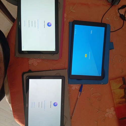 Huawei MediaPad T5 and Alcatel 1T tablets used, with cases