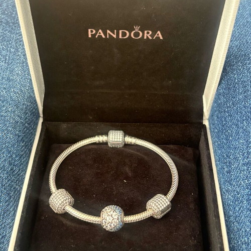 Pandora silver bracelet new with 4 charms and zirconia