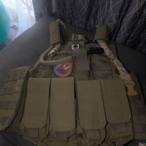 Tactical Vest used with first aid kit and magazine pouches