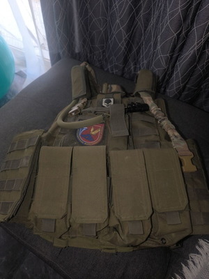 Tactical Vest used with first aid kit and magazine pouches