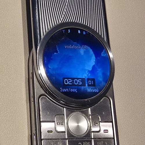 Motorola Aura phone like new, silver with spare battery and charger