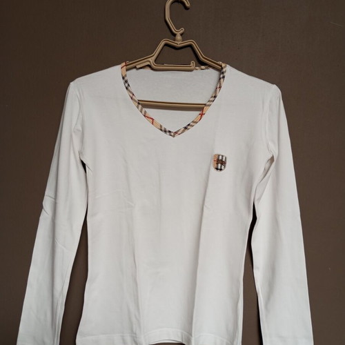 White women's long-sleeve blouse with classic checkered trim, like new