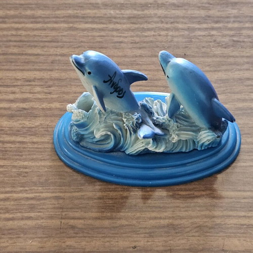 Decorative dolphin pencil holder used