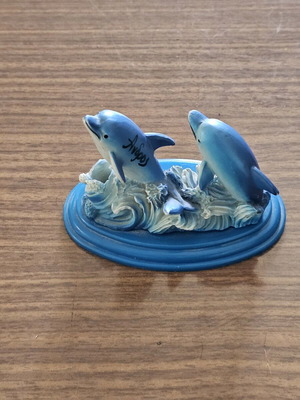 Decorative dolphin pencil holder used