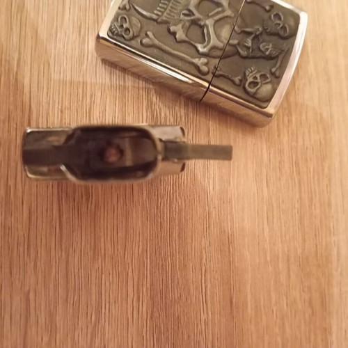 Oil lighter used carved with skull design