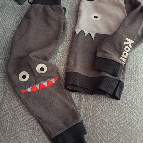 Kids' monster-themed grey tracksuit set used, sizes 2-3