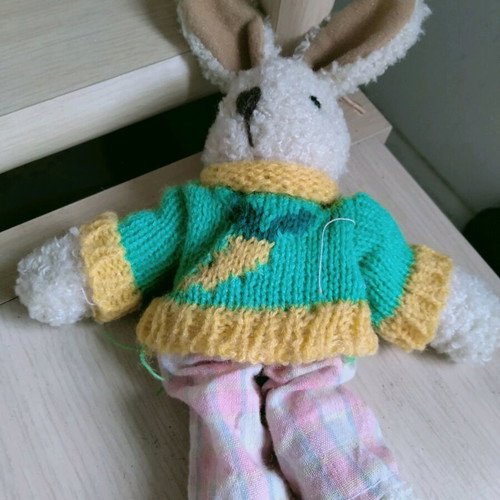 Plush bunny with sweater like new