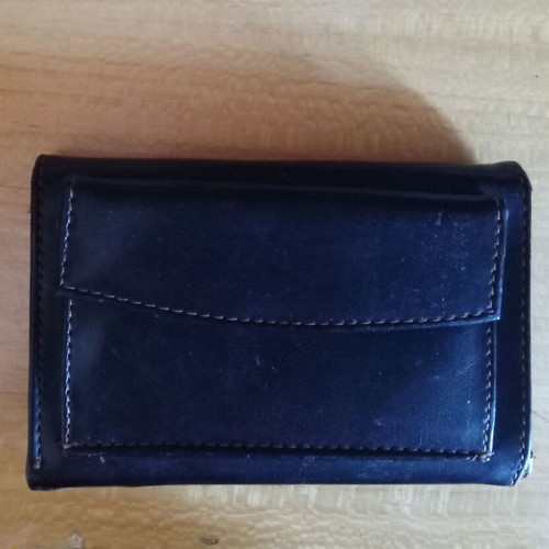 Women's black wallet used with photo and money slots