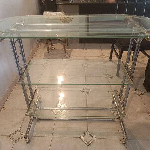 Glass professional shelving unit used with sandblasted glass and nickel frame