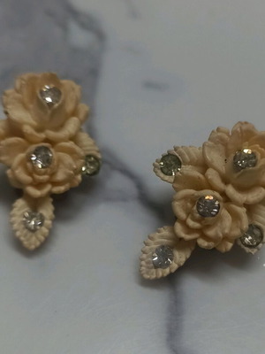 Vintage earrings made of cellulose with carved roses and clip like new