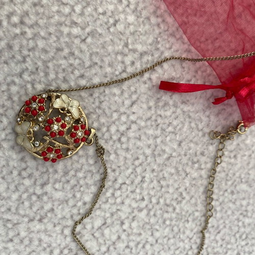 Gold pendant with butterflies and flowers like new