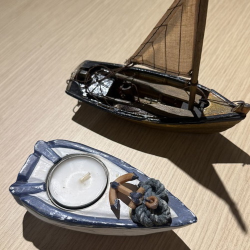 Wooden boat candle holder and decorative boat used