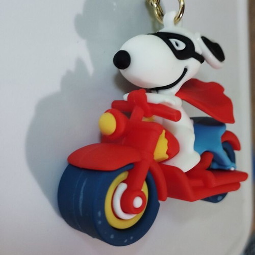 Snoopy figure on motorcycle new, collectible