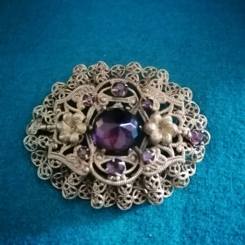 Vintage filigree brooch like new with central stone and rose crystals