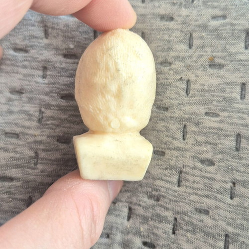 Delikaris football player bust Mr Chips
