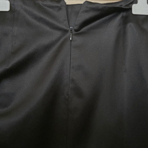 Bill Cost black satin pencil skirt used with decorative closures and slit