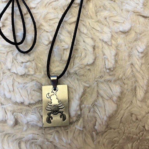 Scorpio zodiac necklace like new stainless steel with leather cord