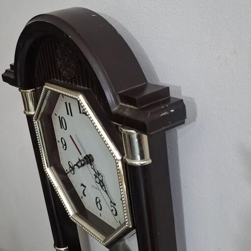 Quartz wall clock with pendulum used, faux wood plastic