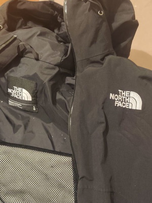 The North Face waterproof windbreaker jacket used, size large, black