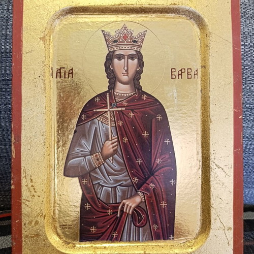 Vintage icon of Saint Barbara on carved wood, used