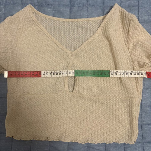 Women's cream crop top with V-neck and keyhole cut-out