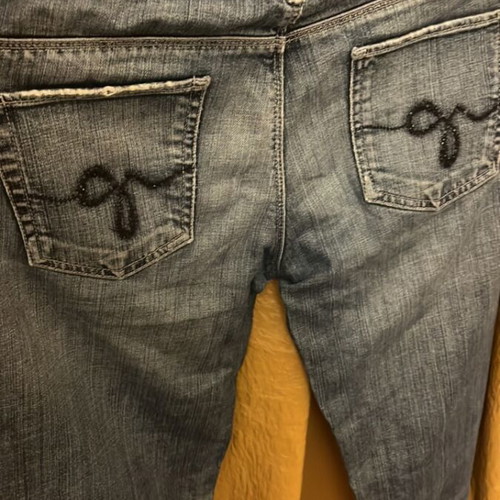 Guess women's jeans used with front rip and pocket designs, size S