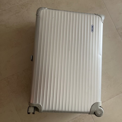 Rimowa travel bag used, silver color, slight defect