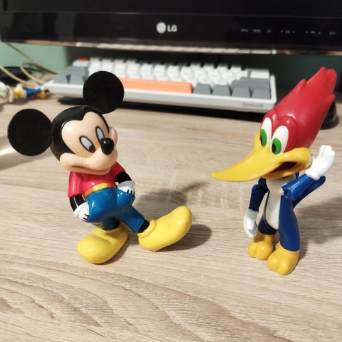 Mickey Mouse and Woody figures like new