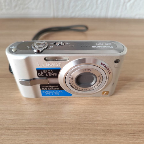 Panasonic Lumix DMC-FX12 digital camera used with accessories