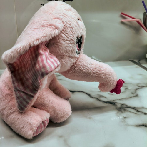 Pink plush elephant like new with embroidered eyes and hanging loop