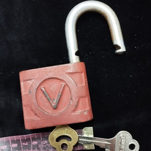 Old padlock used with key and skeleton key