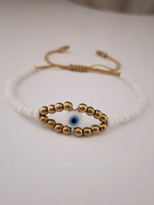 Handmade bracelet with white and gold beads, eye design, adjustable