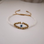 Handmade bracelet with white and gold beads, eye design, adjustable