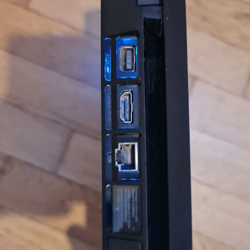 PlayStation 4 Slim 500GB console with controller, HDMI and power cable