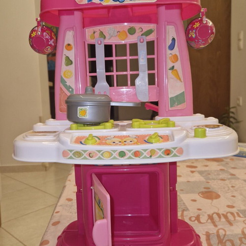 Children's kitchen playset like new with pot, knife, and fork