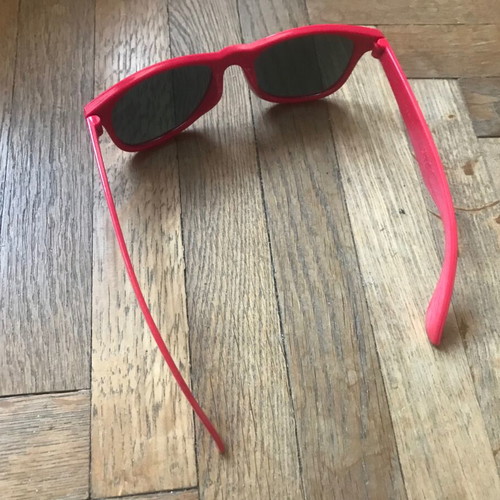 Sunglasses like new with red plastic frame