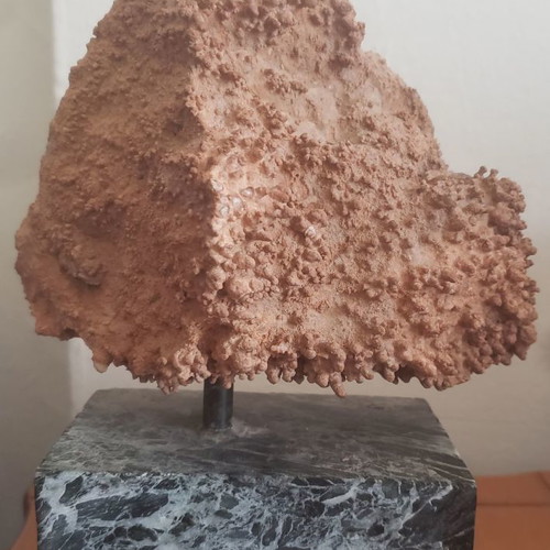 Natural raw mountain crystal used on large marble base