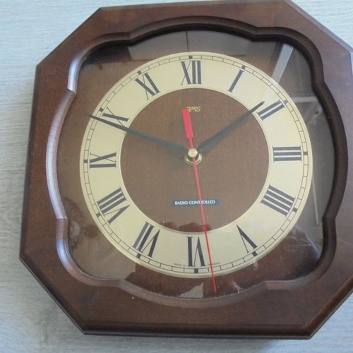 Wall clock radio controlled used with wooden frame and Roman numerals