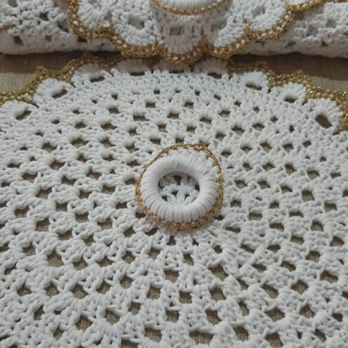 Elegant handmade white table set with gold details and napkin rings